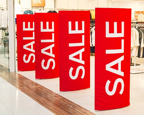 The Power of Colour - Red Sale signs in a shop entry
